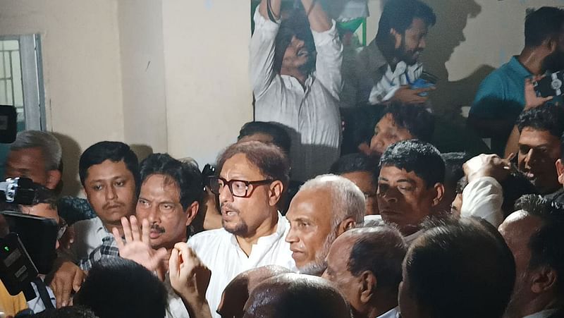 Surrounded by the party leaders and activists, BNP leader Shahadat Hossain is seen at the court premises in Chattogram on 1 October 2024.