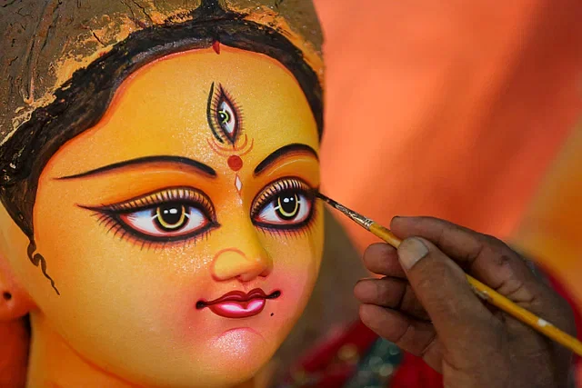 Finishing touches on an idol on the occassion of Durga Puja.