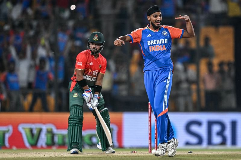 India's Arshdeep Singh celebrates after taking the wicket of Bangladesh's Parvez Hossain Emon (L) during the first Twenty20 cricket match between India and Bangladesh at the Shrimant Madhavrao Scindia Cricket Stadium in Gwalior on October 6, 2024