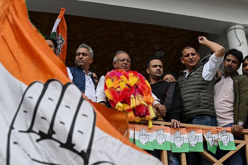 Tariq Hameed Karra (C), regional President of Indian National Congress (INC) party, looks on after his win in the assembly election in Srinagar on 8 October, 2024.