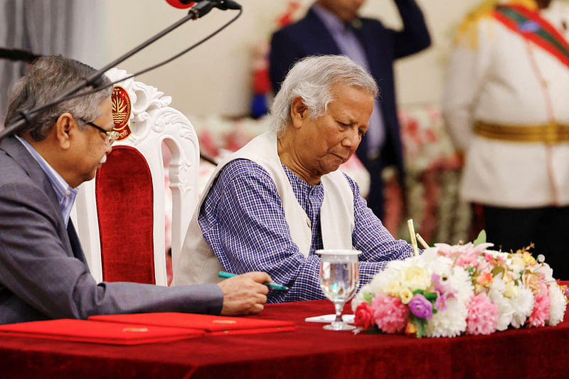 Nobel laureate Muhammad Yunus signs the oath book as the country’s head of the interim government in Bangladesh at the Bangabhaban, in Dhaka, Bangladesh, on 8 August 2024