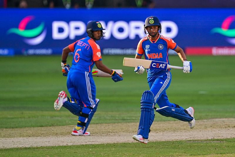 India’s captain Harmanpreet Kaur (R) and her teammate Deepti Sharma take a run during the ICC Women’s T20 World Cup cricket match between Pakistan and India at the Dubai International Cricket Stadium in Dubai on 6 October 2024