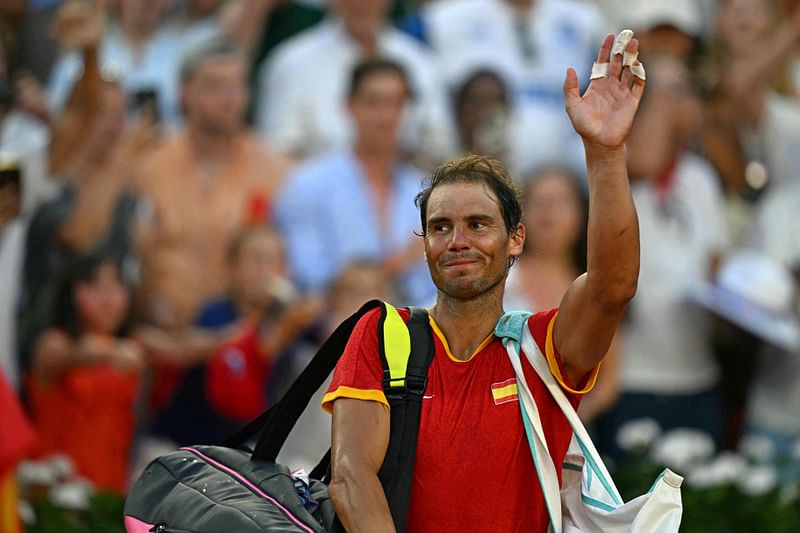 Spain's Rafael Nadal waves as he leaves after he and Spain's Carlos Alcaraz beat Netherlands' Tallon Griekspoor and Netherlands' Wesley Koolhof in their men's doubles second round tennis match on Court Suzanne-Lenglen at the Roland-Garros Stadium during the Paris 2024 Olympic Games, in Paris on 30 July, 2024.