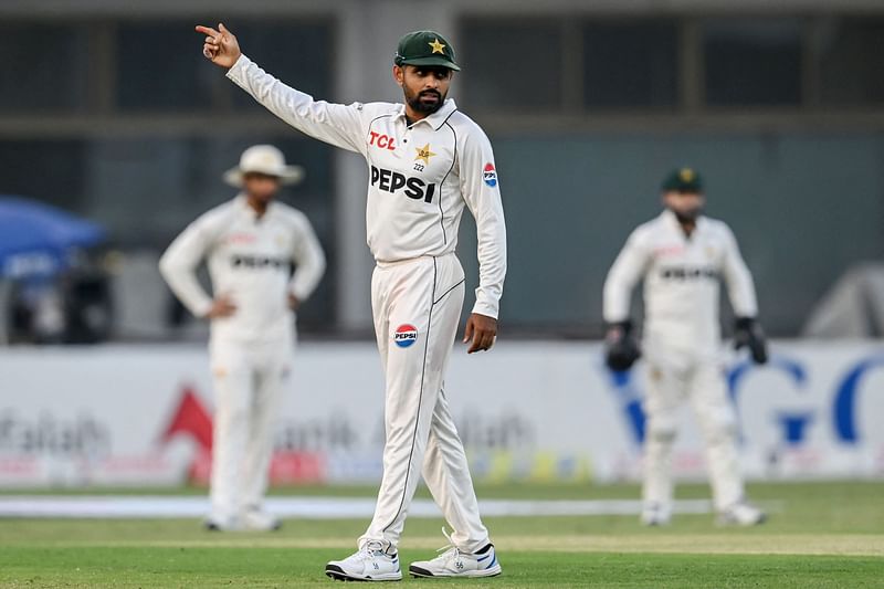 Pakistan's Babar Azam gestures during the second day of the first Test cricket match between Pakistan and England at the Multan Cricket Stadium in Multan on October 8, 2024