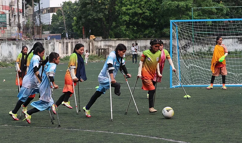 Girls with amputated limbs play amputee football on the artificial turf of BFF during a friendly match on 10 October 2024.