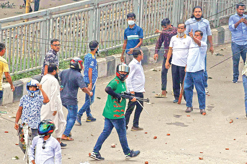 Murtafa Bin Omar, vice president of Turag thana Chhatra League, with arms on 4 August