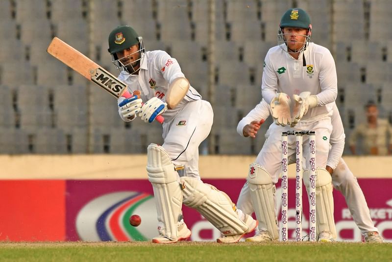 Bangladesh's Mahmudul Hasan Joy (L) plays a shot during the second day of the first Test cricket match between Bangladesh and South Africa at the Sher-e-Bangla National Cricket Stadium in Dhaka on 22 October 2024.