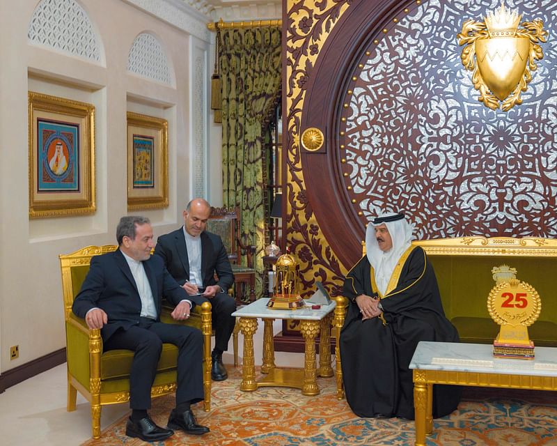 This handout picture from the official Bahrain News Agency (BNA) shows Bahrain's King Hamad bin Isa Al Khalifa (R) meeting with Iran's Foreign Minister Abbas Araghchi in Manama on October 21, 2024