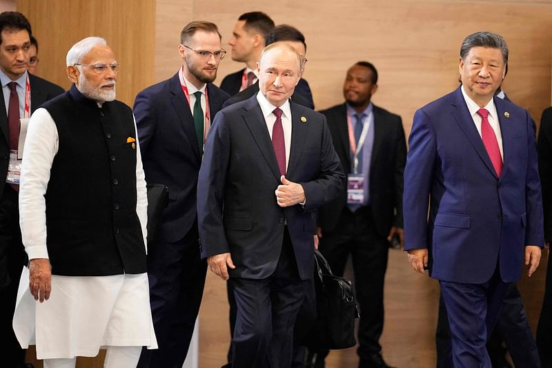 Indian Prime Minister Narendra Modi, Russian President Vladimir Putin and Chinese President Xi Jinping attend a family photo during the BRICS summit in Kazan on 23 October, 2024