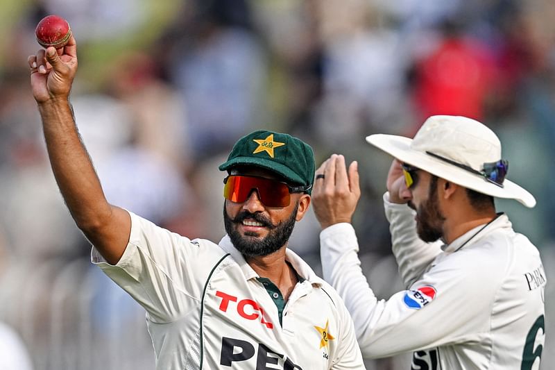 Pakistan's Sajid Khan (L) gestures after taking a five-wicket haul during the first day of the third and final Test cricket match between Pakistan and England at the Rawalpindi Cricket Stadium in Rawalpindi on October 24, 2024.