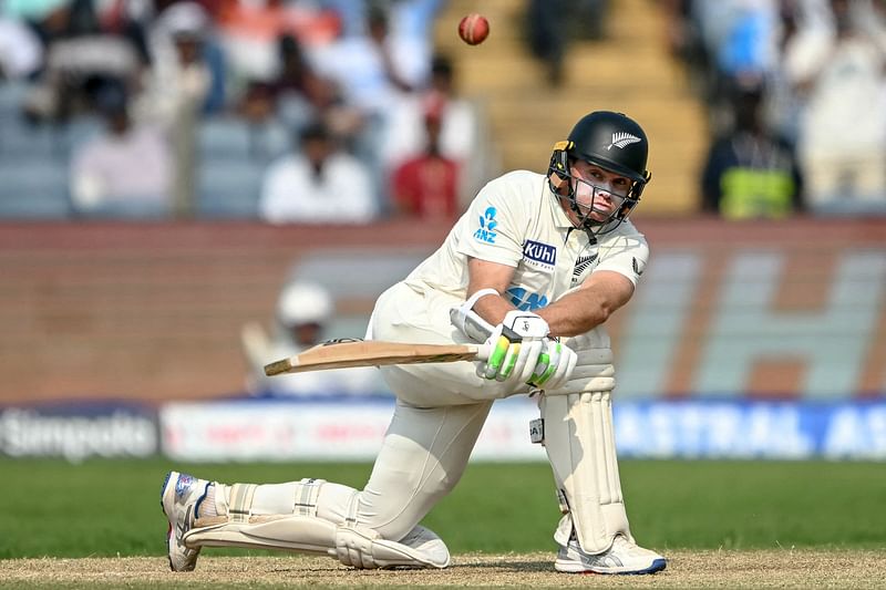 New Zealand’s captain Tom Latham plays a shot during the second day of the second Test cricket match between India and New Zealand at the Maharashtra Cricket Association Stadium in Pune on 25 October 2024