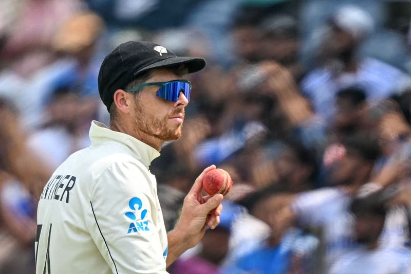 New Zealand’s Mitchell Santner gestures after taking a five-wicket haul during the second day of the second Test cricket match between India and New Zealand at the Maharashtra Cricket Association Stadium in Pune on 25 October 2024