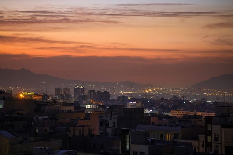 Part of the city skyline is pictured at dawn after several explosions were heard in Tehran on 26 October, 2024. Israel announced the launch of "precise strikes" on military targets in Iran on 26 October in retaliation for Iranian attacks, as an AFP journalist in Tehran reported hearing several explosions.