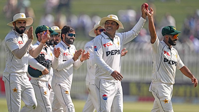 Pakistan's Sajid Khan (R) and Noman Ali (2R) celebrate along with teammates as they walk off the field after the end of England's second innings during the third day of the third and final Test cricket match between Pakistan and England at the Rawalpindi Cricket Stadium in Rawalpindi on 26 October, 2024