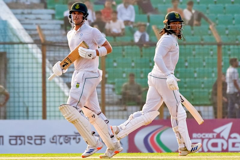 South Africa's Tony de Zorzi (R) and Tristan Stubbs run between the wickets during the first day of the second Test cricket match between Bangladesh and South Africa at the Zahur Ahmed Chowdhury Stadium in Chittagong on 29 October 2024.