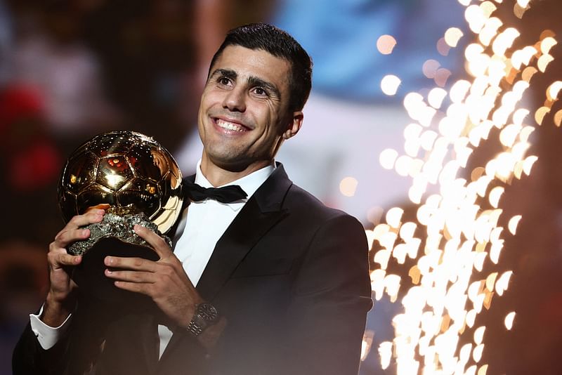 Manchester City’s Spanish midfielder Rodri receives the Ballon d’Or award during the 2024 Ballon d’Or France Football award ceremony at the Theatre du Chatelet in Paris on 28 October 2024