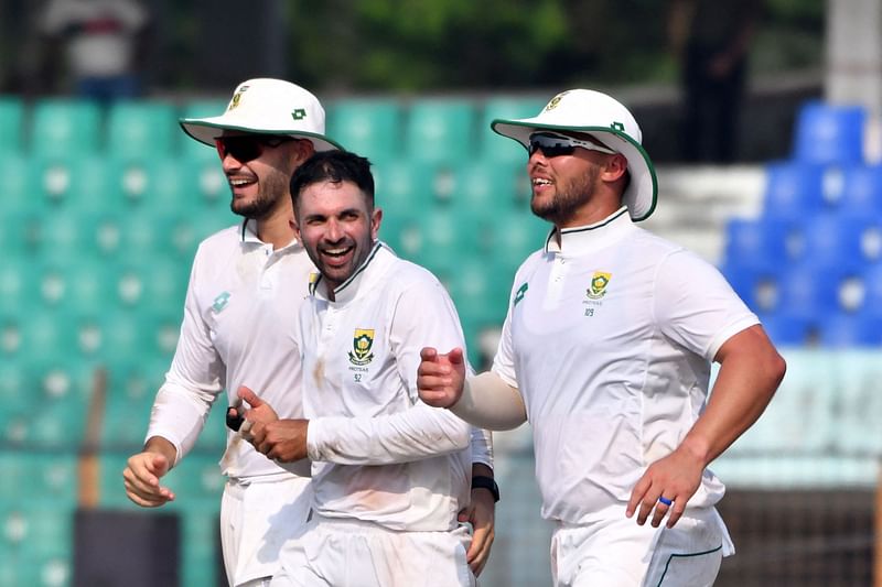 South Africa’s Keshav Maharaj celebrates with teammates after the dismissal of Bangladesh’s Mominul Haque during the third day of the second Test cricket match with South Africa at the Zahur Ahmed Chowdhury Stadium in Chattogram on 31 October, 2024.