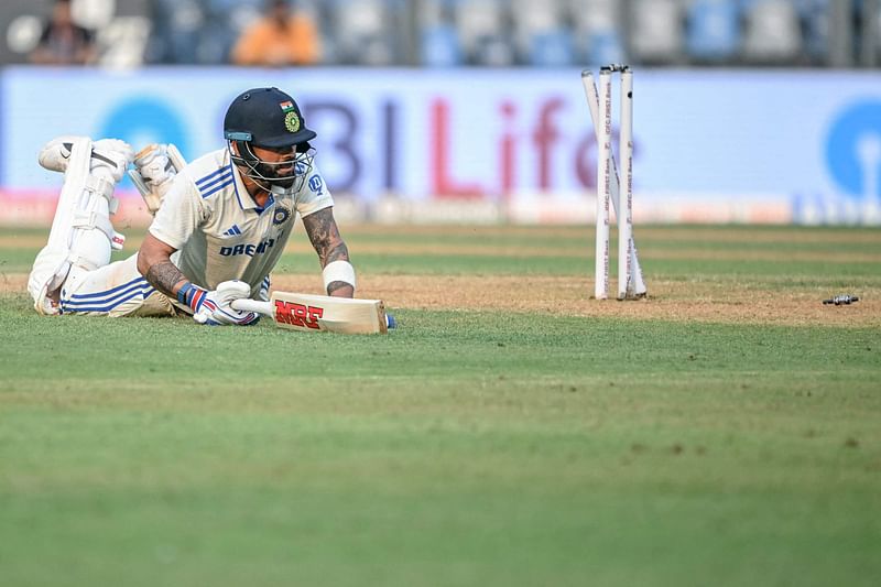 India’s Virat Kohli is being run out by New Zealand’s Matt Henry during the first day of the third Test cricket match between India and New Zealand at the Wankhede Stadium in Mumbai on 1 November 2024