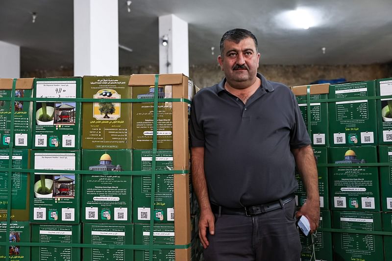 Palestinian-American entrepreneur Jamal Zaglul poses for a picture in front of his olive press in the village of Turmus Aya in the Israeli-occupied West Bank, on 30 October, 2024.