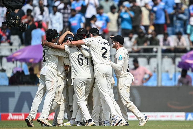 New Zealand's players celebrate after winning the third and final Test cricket match between India and New Zealand at the Wankhede Stadium in Mumbai on November 3, 2024