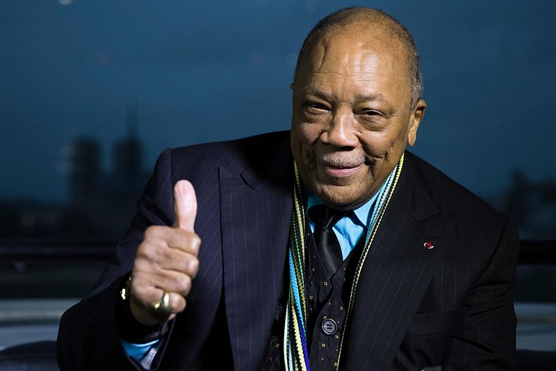 US musician and producer Quincy Jones poses after being awarded Grand Commandeur de l'Ordre des Arts et des Lettres on 6 October, 2014 at the Institut du Monde Arabe (Arabic World Institute) in Paris.