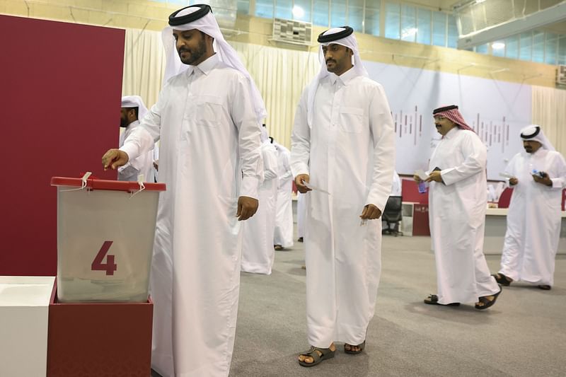 Qatari voters cast their ballots at a polling station in Doha on 5 November, 2024.