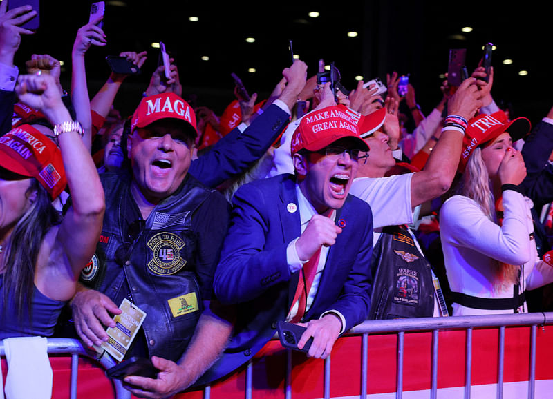 Supporters of Republican presidential nominee and former US President Donald Trump celebrate after the Fox Network called the election in his favor at the site of his rally, at the Palm Beach County Convention Center in West Palm Beach, Florida, US, on 6 November 2024