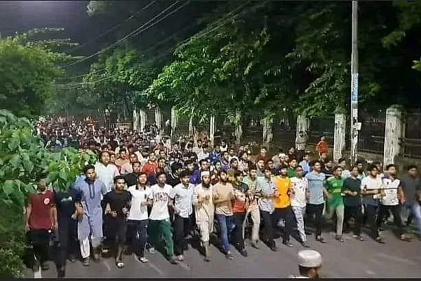 Students demonstrate late Wednesday night over Chhatra Dal posters in Dhaka University campus