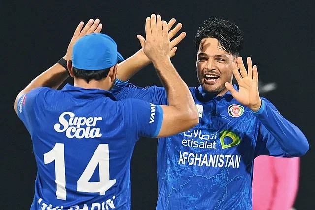 AM Ghazanfar celebrates with teammates after taking a wicket