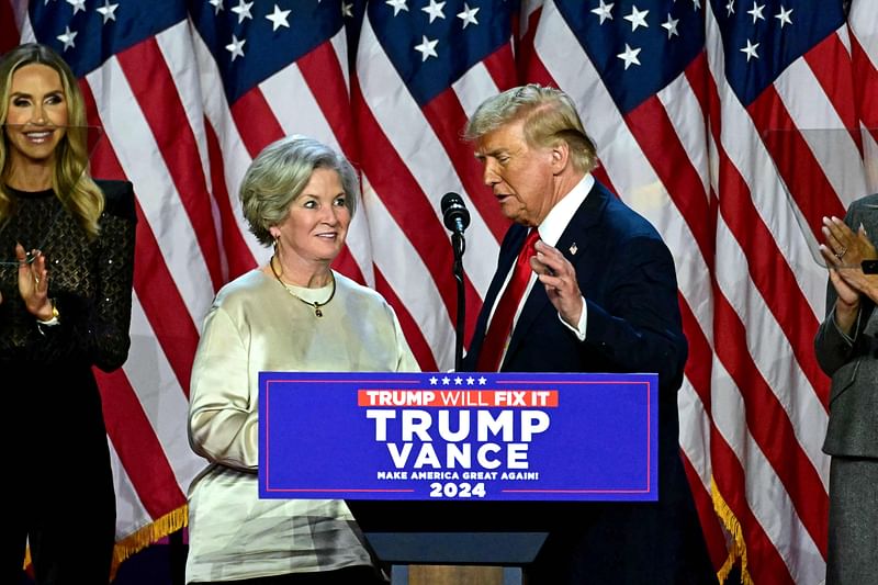 Former US President and Republican presidential candidate Donald Trump greets his campaign manager Susie Wiles (L) during an election night event at the West Palm Beach Convention Center in West Palm Beach, Florida, on 6 November, 2024.