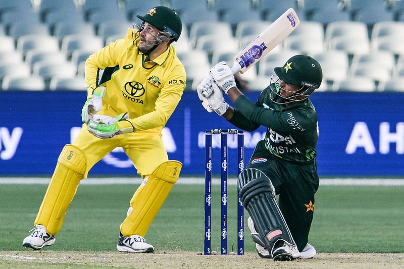 Pakistan’s Saim Ayub hits a four watched in front of Australia’s wicket-keeper Josh Inglis during the one-day international cricket match between Australia and Pakistan at Adelaide Oval in Adelaide on 8 November 2024