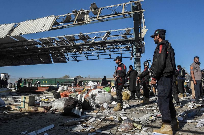 Security personnel inspect the blast area after an explosion at a railway station in Quetta, in Pakistan's Balochistan province on 9 November, 2024.