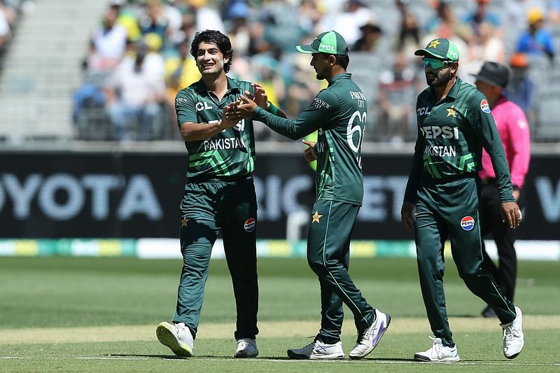 Pakistan’s Mohammad Hasnain (L) celebrates getting the wicket of Australia’s Adam Zampa during the third one-day international (ODI) cricket match between Australia and Pakistan at the Perth Stadium in Perth on 10 November, 2024.