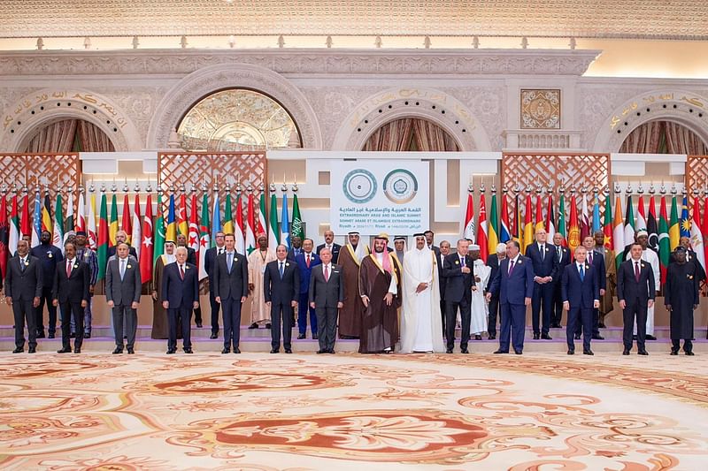 A handout picture provided by the Saudi Press Agency SPA shows Saudi Crown Prince Mohammed bin Salman (C) posing for a group picture with leaders from member states of the Organization of Islamic Cooperation (OIC) and the Arab League during their joint extraordinary summit in Riyadh on 11 November, 2024.