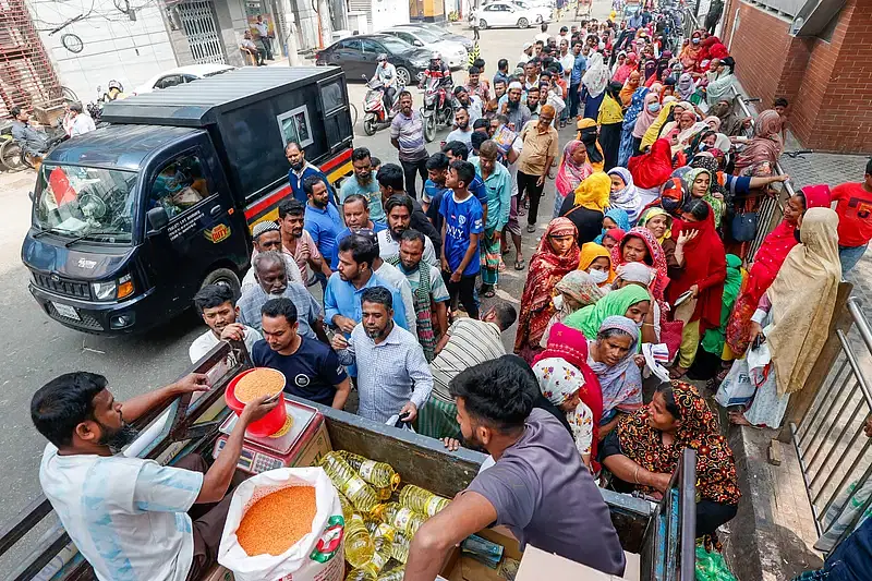 Long queues of customers behind the TCB trucks selling daily commodities at subsidised prices at Karwan Bazar area in the capital on 16 November 2024.