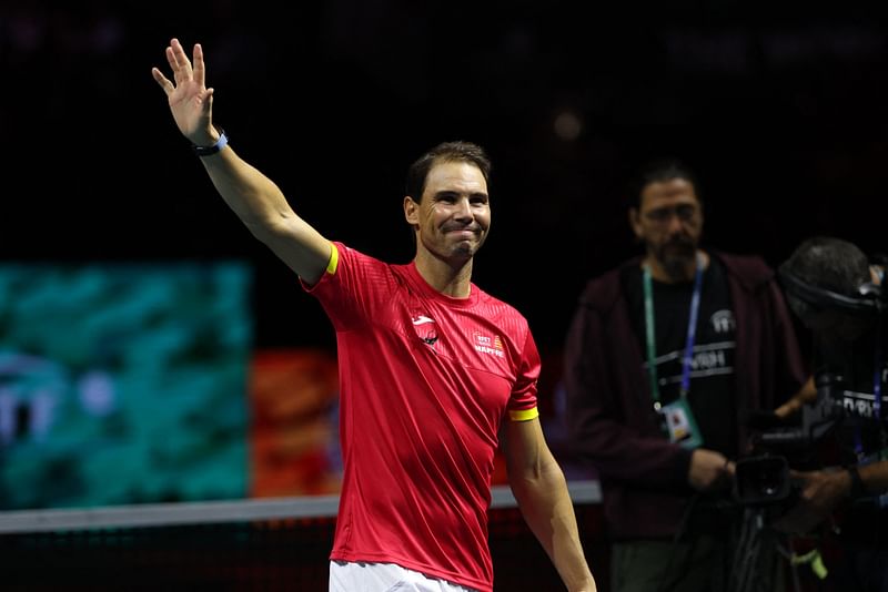 Spain’s Rafael Nadal waves during a tribute to his career at the end of the quarter-final doubles match between Netherlands and Spain during the Davis Cup Finals at the Palacio de Deportes Jose Maria Martin Carpena arena in Malaga, southern Spain, on 19 November 2024