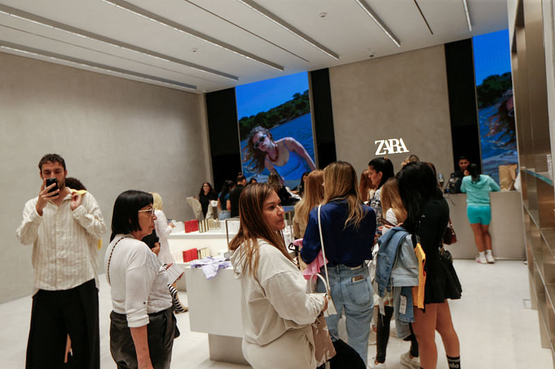 People shop during the opening of a Zara store after fashion giant Inditex resumed its operations in Venezuela under a franchise agreement, in Caracas, Venezuela on 25 April 2024.