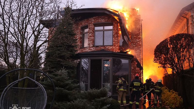 This handout photograph taken and released by the Ukrainian Emergency Service on 21 November, 2024 shows Ukrainian firefighters work on a spot following an air-attack, in Dnipro