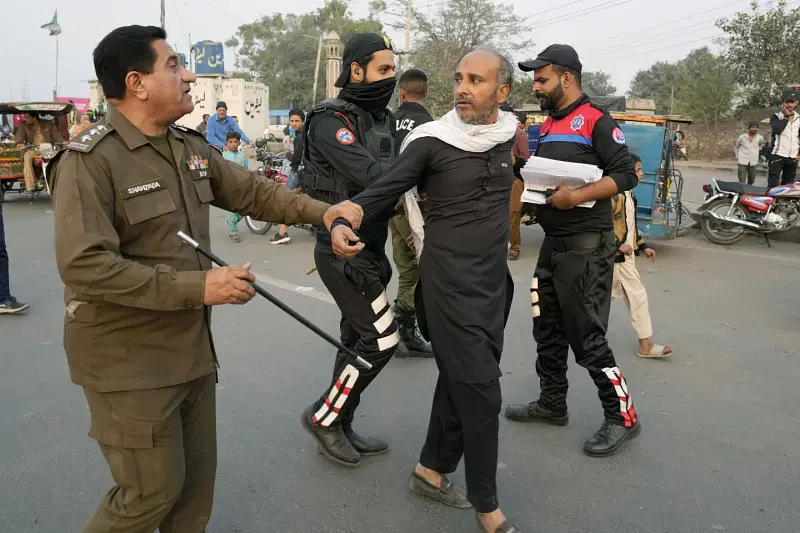 Police officers detain a supporter of imprisoned former premier Imran Khan's Pakistan Tehreek-e-Insaf party, which supporters gather for a rally demanding Khan's release, in Lahore, Pakistan, Sunday, 24 November, 2024