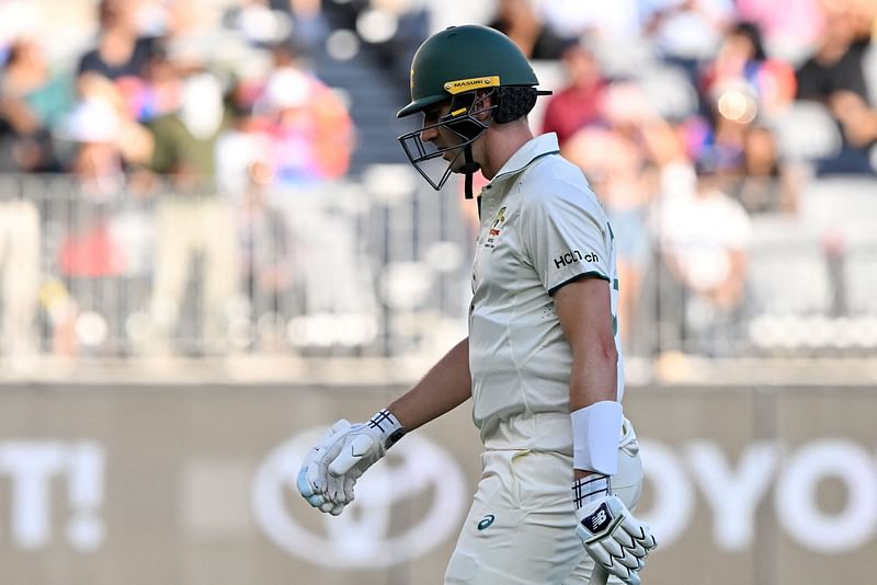 ustralia’s Pat Cummins walks off the field after his dismissal off India’s paceman Mohammed Siraj during day three of the first Test cricket match between Australia and India at Optus Stadium in Perth on 24 November, 2024