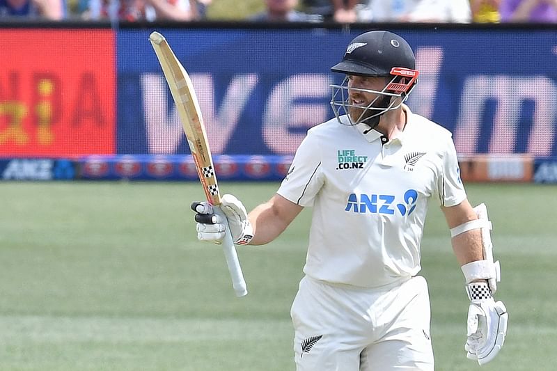 New Zealand’s Kane Williamson celebrates after scoring 50 runs (half century) during the first day of the first Test cricket match between New Zealand and England at Hagley Oval in Christchurch on 28 November 2024