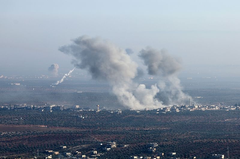 In this picture taken from the northern Syrian village of Ariha, smoke billows from the site of clashes and mutual shelling between Syrian jihadists and allied factions and regime forces on the front lines on the outskirts of the city of Saraqib in Syria's Aleppo province on 28 November, 2024