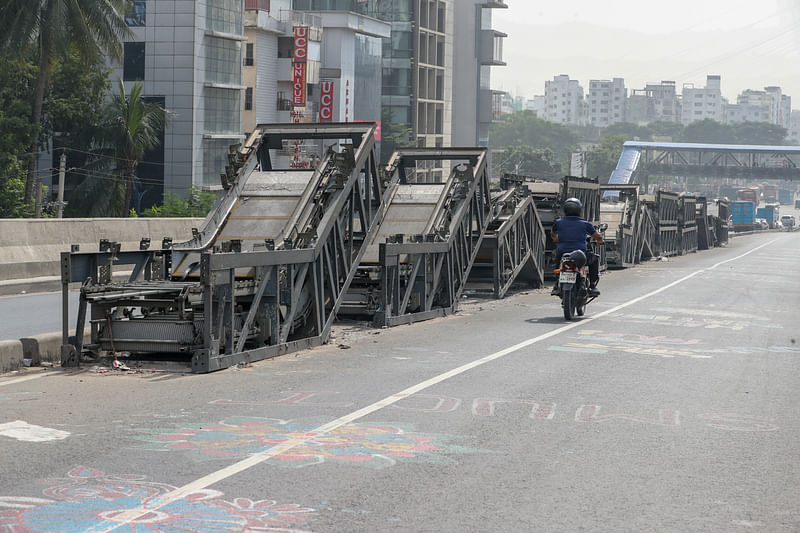 The photo shows damaged escalators on the expressway of the BRT (bus rapid transit) project in the House Building area, Dhaka.