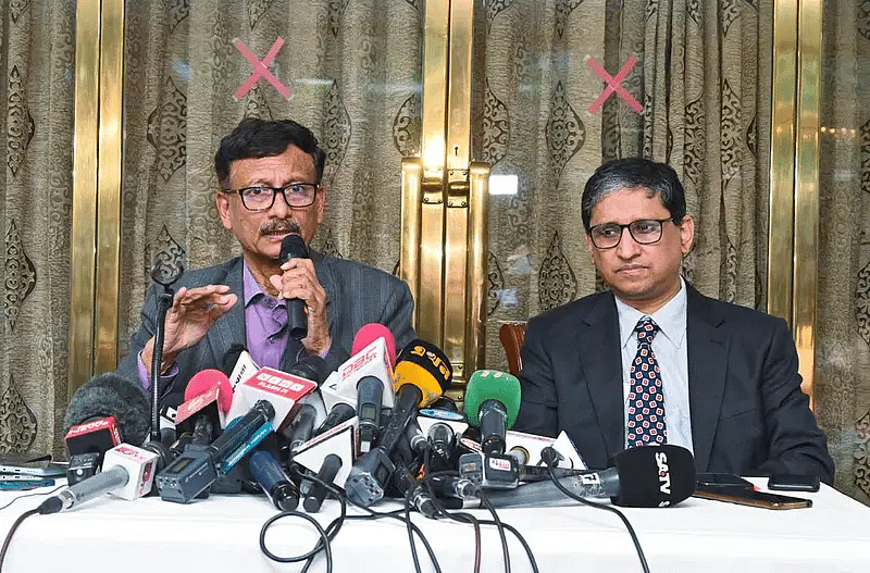 Foreign adviser Md Touhid Hossain (L) talks to the media