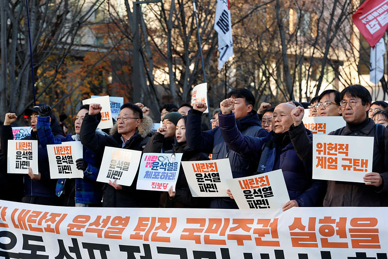 People take part in a rally to demand South Korean President Yoon Suk Yeol’s removal from power, in Seoul, South Korea, on 4 December 2024