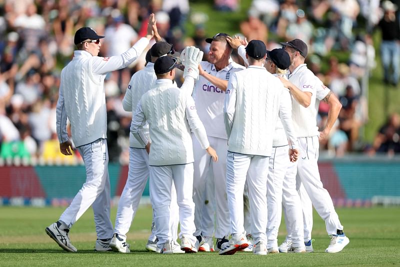 England’s Brydon Carse (C) celebrates after New Zealand’s Kane Williamson was caught on day one of the second Test cricket match between New Zealand and England at the Basin Reserve in Wellington on 6 December 2024