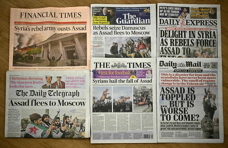 A picture shows the front pages of some of Britain's national newspapers, dominated by stories about the fall of Syria's President, in London on 9 December 2024