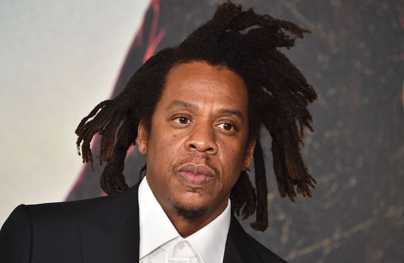 US rapper Jay-Z arrives for the Los Angeles Special Screening of Netflix's "The Harder They Fall" at the Shrine Auditorium in Los Angeles, 13 October, 2021. Musician and producer Jay-Z was accused in a lawsuit submitted 8 December of raping a 13-year-old with hip-hop star Sean Combs in the year 2000, court documents show, claims denied by Jay-Z.