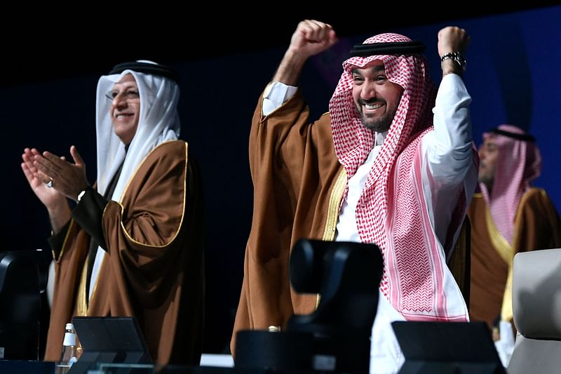 Asian Football Confederation (AFC) President Sheikh Salman bin Ibrahim al-Khalifa (L) and Saudi Arabia’s Minister of Sports and Youth Abdulaziz bin Turki al-Faisal al-Saud celebrate after Saudi Arabia was confirmed as host of the 2034 World Cup during a ceremony in the capital Riyadh on 11 December 2024