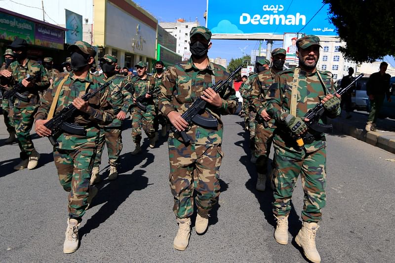 Security forces loyal to Yemen's Huthi movement march in the Huthi-run capital Sanaa in support of the Palestinians and against the US and Israel, on December 18, 2024